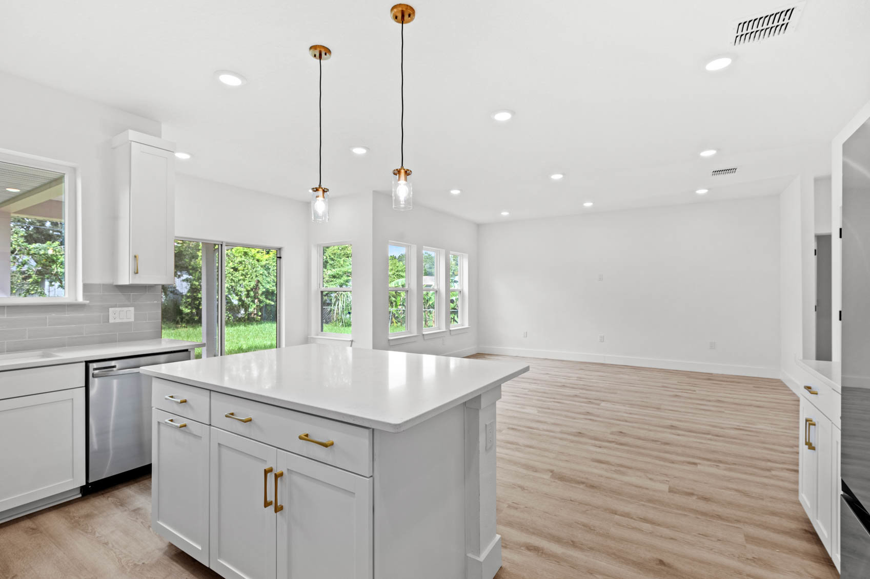 looking into living room with wood floor and white walls